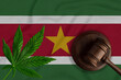 Cannabis and Judge Gavel on the Suriname Flag Background