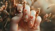 A womans hand adorned with intricate floral designs on the nails