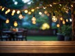 The string lights in the background are strung across a tree branch, which is blurred out of focus.
