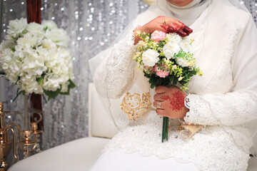 Wall Mural - Beautiful wedding bouquet in hands of the bride. Trendy and modern wedding flowers.