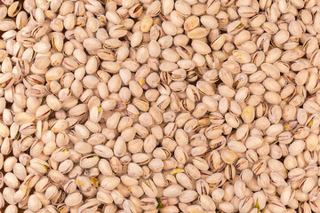Wall Mural - Background of the roasted salted pistachio nuts, top view