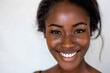Closeup portrait of Beautiful smiling African American woman woman with smooth healthy skin