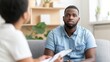 Depressed black man at psychologist