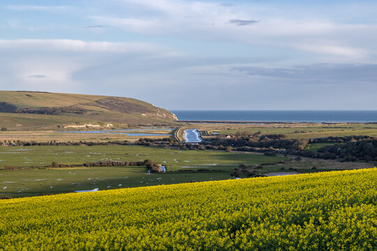 A view over farmland and the Cuckmere Valley towards the Sussex coast