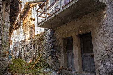 Wall Mural - Derelict old houses in the historic hill village of Timau in Udine Province, Friuli-Venezia Giulia, North East Italy. Part of the Paluzza municipality