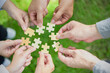  business hands holding jigsaw puzzle With the cooperation of business people team joins together to campaign Environment, Society and Corporate Governance. Sustainable corporate social, environmental