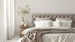 Chic bedroom design showcasing a tufted grey headboard, soft white linens, and a rustic bedside table with a vase of flowers.