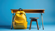 Bright Yellow School Bag Laden with Educational Gear against a Blue Backdrop