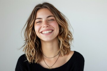 Wall Mural - Woman Smiling On White. Portrait of Carefree Woman with White Smile, Laughing Happily in Fashionable Lifestyle