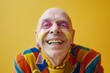 bald senior man with bright make up being happy on bright background