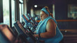 Focused fat Woman Exercising on Trainer, A determined woman using an trainer in a gym, concentrating on her fitness goals.