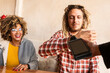 © ADDICTIVE STOCK - Joyful Friends Sharing Payment at a Cozy Bar