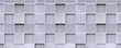Geometric square pattern background of expanded aluminium grating wall decoration outside of modern building in panoramic view