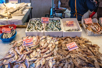 Sticker - Fishes and squids on food market in Syracuse historic city on Sicily Island, Italy