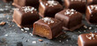 Luxurious chocolate-covered caramels dusted with flakes of sea salt, sweet indulgence.