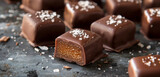 Fototapeta Natura - Luxurious chocolate-covered caramels dusted with flakes of sea salt, sweet indulgence.