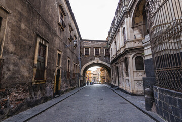 Wall Mural - Arch of Saint Benedict of Benedictine Abbey in historic part of Catania city, Sicily Island, Italy