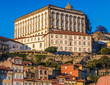 View from river on Ribeira area of Porto city, view with Episcopal Palace, Portugal