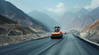 A road roller smoothly paved a freshly constructed asphalt road, with mountainous scenery in the background
