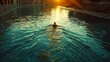 Lone swimmer in a tranquil azure pool at sunset