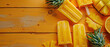 pineaple slice popsicles on a orange rustic wood background , with empty copy space