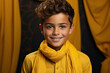 A portrait of a stylish Muslim boy in Shalwar Kameez with a vibrant yellow backdrop.