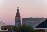 Fototapeta Las - The Martinitoren and teh Forum building on a clear morning in the historical city centre of Groningen.