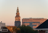 Fototapeta Las - The Martinitoren and teh Forum building on a clear morning in the historical city centre of Groningen.
