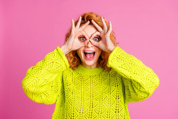 Wall Mural - Photo of funny lovely crazy girl wear trendy green clothes look binoculars isolated on vibrant pink color background