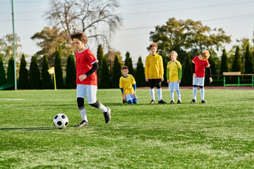 Wall Mural - A group of young children, filled with joy and enthusiasm, are engaged in a spirited game of soccer. 