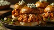 Close-Up View of Spicy Buffalo Chicken Sliders with Crumbled Blue Cheese and Fresh Parsley