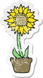 retro distressed sticker of a cartoon sunflower