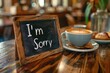 An I m Sorry message on a cafe chalkboard paired with coffee creates a heartfelt scene