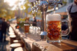 Beer pouring by bartender at Oktoberfest, side view, tap to glass action, bar setting