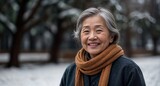 Fototapeta  -  Happy elderly asian lady in winter with copy space