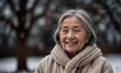  Happy elderly asian lady in winter with copy space