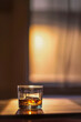 Highend scotch whiskey on table, eyelevel, warm cinematic glow, closeup, centered, AR 21,  8K, no noise, low texture