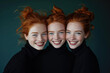Portrait of three ginger young charming sisters