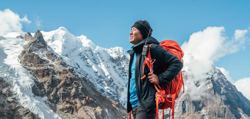 Wall Mural - portrait of smiling sherpa man with backpack enjoying mountain views and fresh air with mera peak 64
