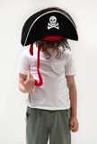 Fototapeta  - Child sporting a pirate hat with skull and crossbones design