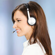 Call center service. Profile portrait of Customer support phone sales operator wear headset, white cloth, against blurred office background. Advisor help line. Square image.