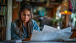 © Pawina - a worried female hispanic women looking over papers on a table,generative ai