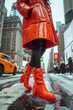 Closeup of a fashionforward pedestrian crossing the street, the citys fashion trends captured in one bold look