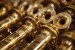Detailed view of shiny brass trumpet parts with a focus on craftsmanship and musical instrument design