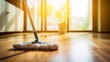Mop cleaning wooden floor in sunlit room symbolizing household 