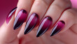 Gel nail extension dark purple. A long nail extension with a lilac coating of nail polish. close up