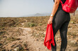 Close up of a handkerchief held by a woman who is hiking the hills