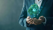 Concept of artificial intelligence and technology for sustainable development goals, businessman holding tree graphic with text “AI”