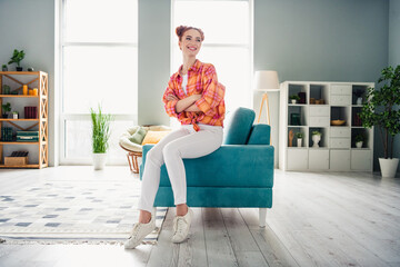 Sticker - Full body photo of positive nice lady sit couch folded arms contemplate enjoy comfy domestic atmosphere house indoors