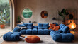 Modern living room interior with blue modular sofa, stylish decor, and large windows.